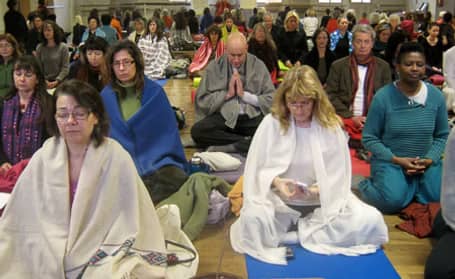 Animated discussion during an older gathering.