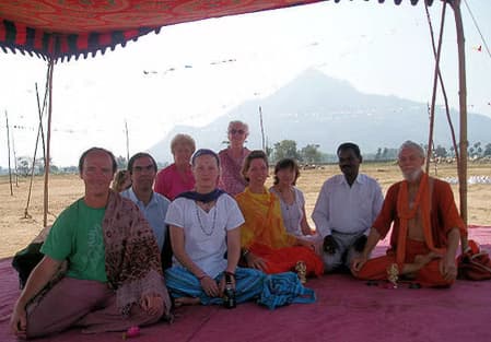 Archive workshop photo of participants in listening and mantra recitation practice with focused attention.